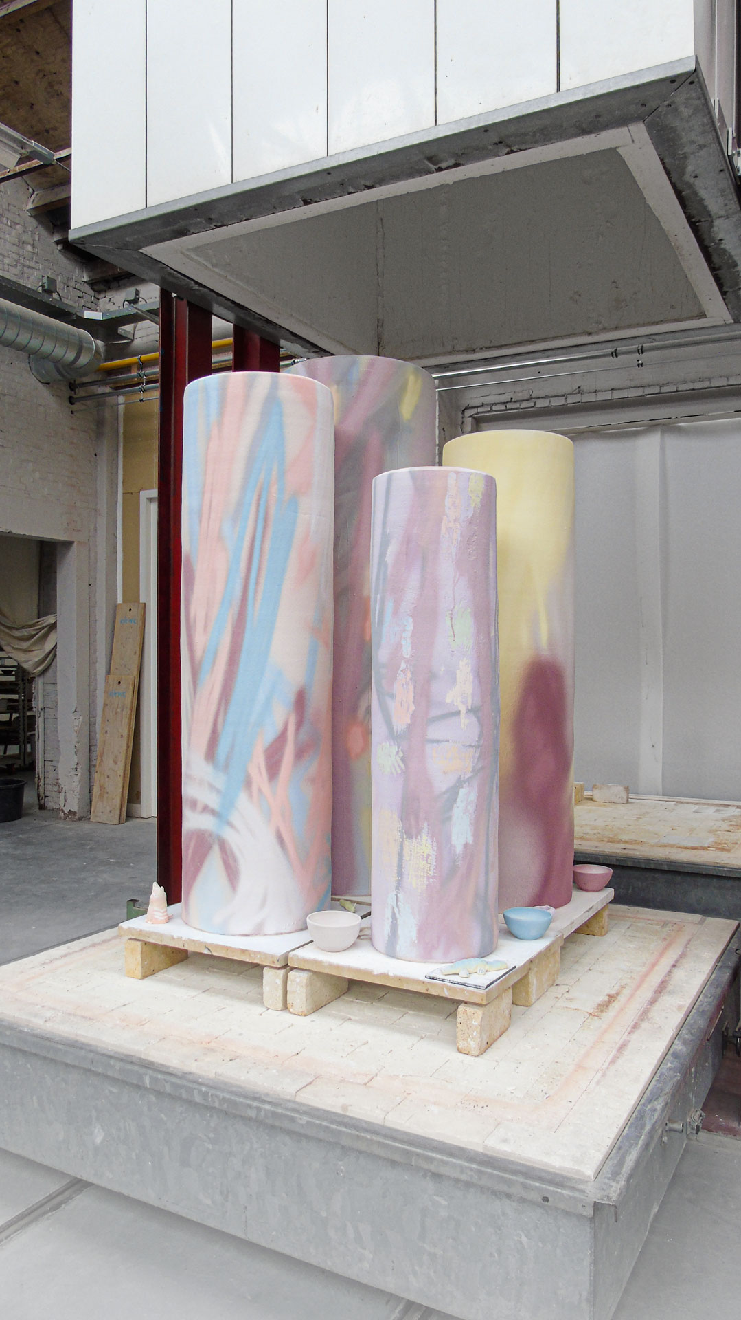 Glazed columns before and after glaze firing